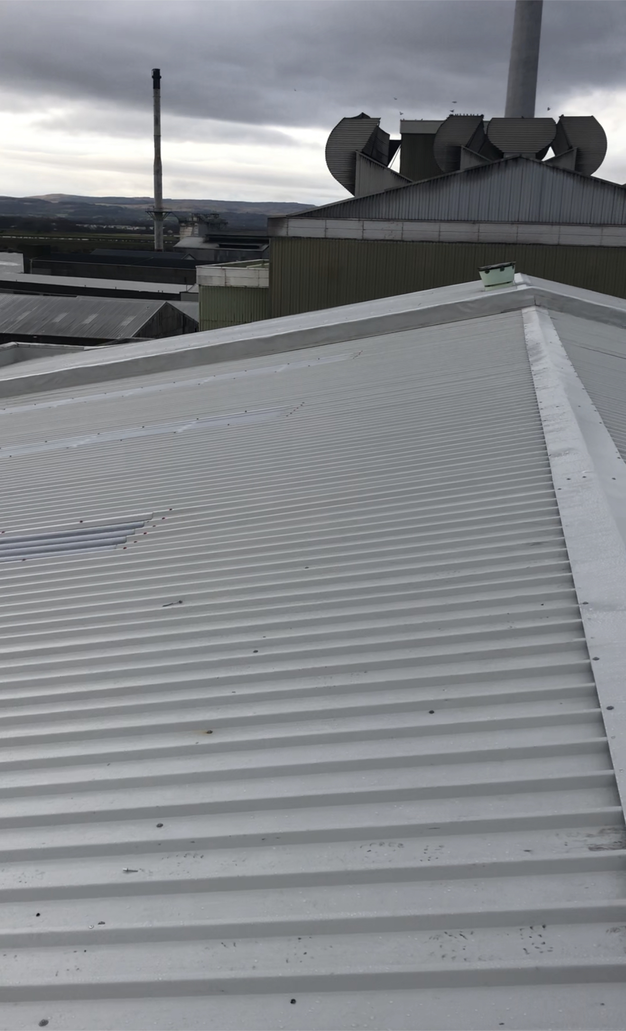Metal roof overcladding refurbishment on an existing industrial building