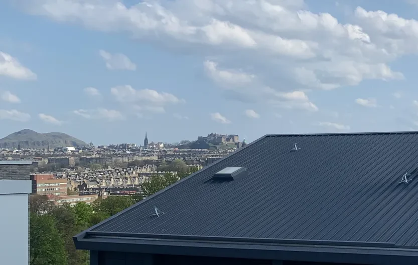Industrial roofing Edinburgh with Arthur’s Seat and Edinburgh Castle in background by Modern Roofing Scotland
