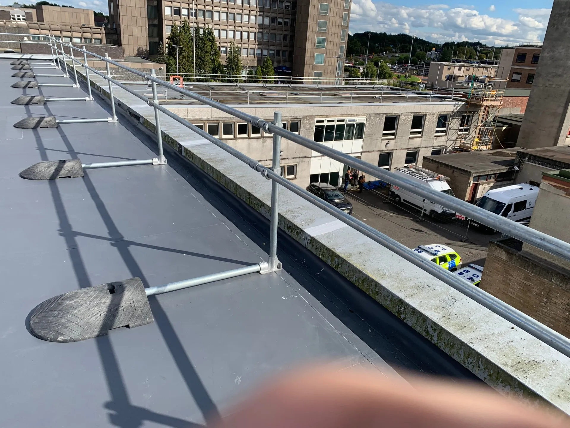 East Kilbride Police Station roofing works with liquid-applied roofing and Sika single-ply membrane areas
