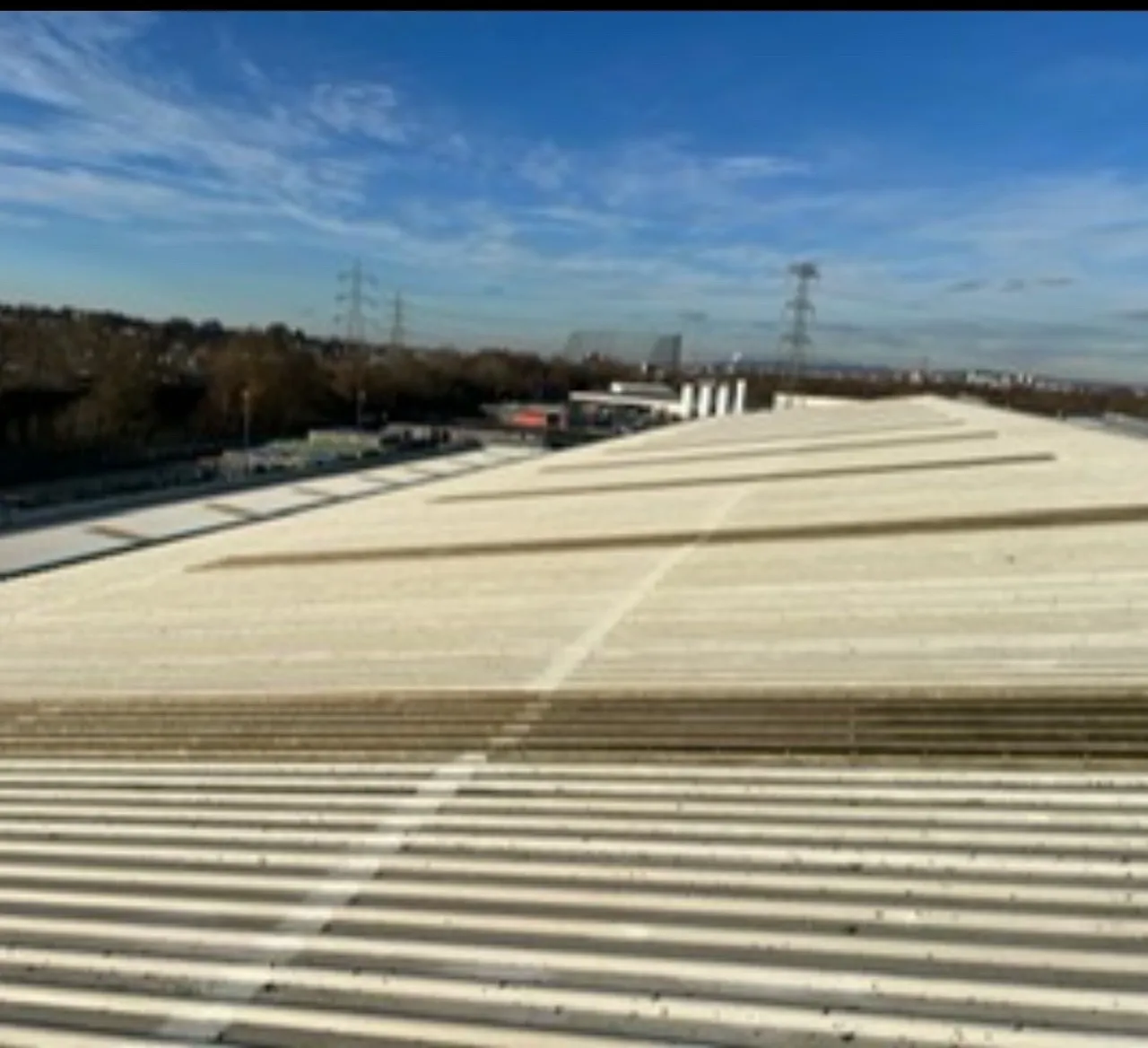 Completed Sika cut edge corrosion treatment to industrial metal roof sheet ends