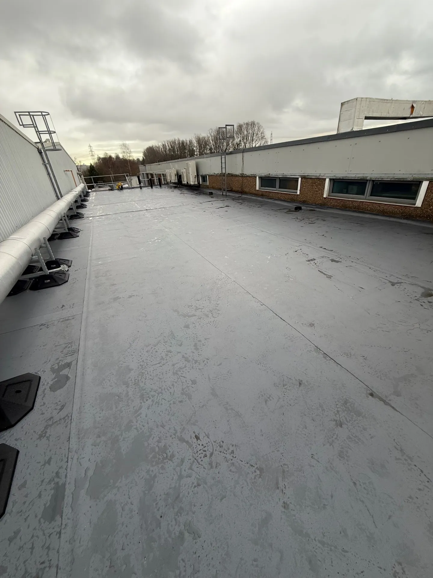Finished lower roof area following Sika membrane works.