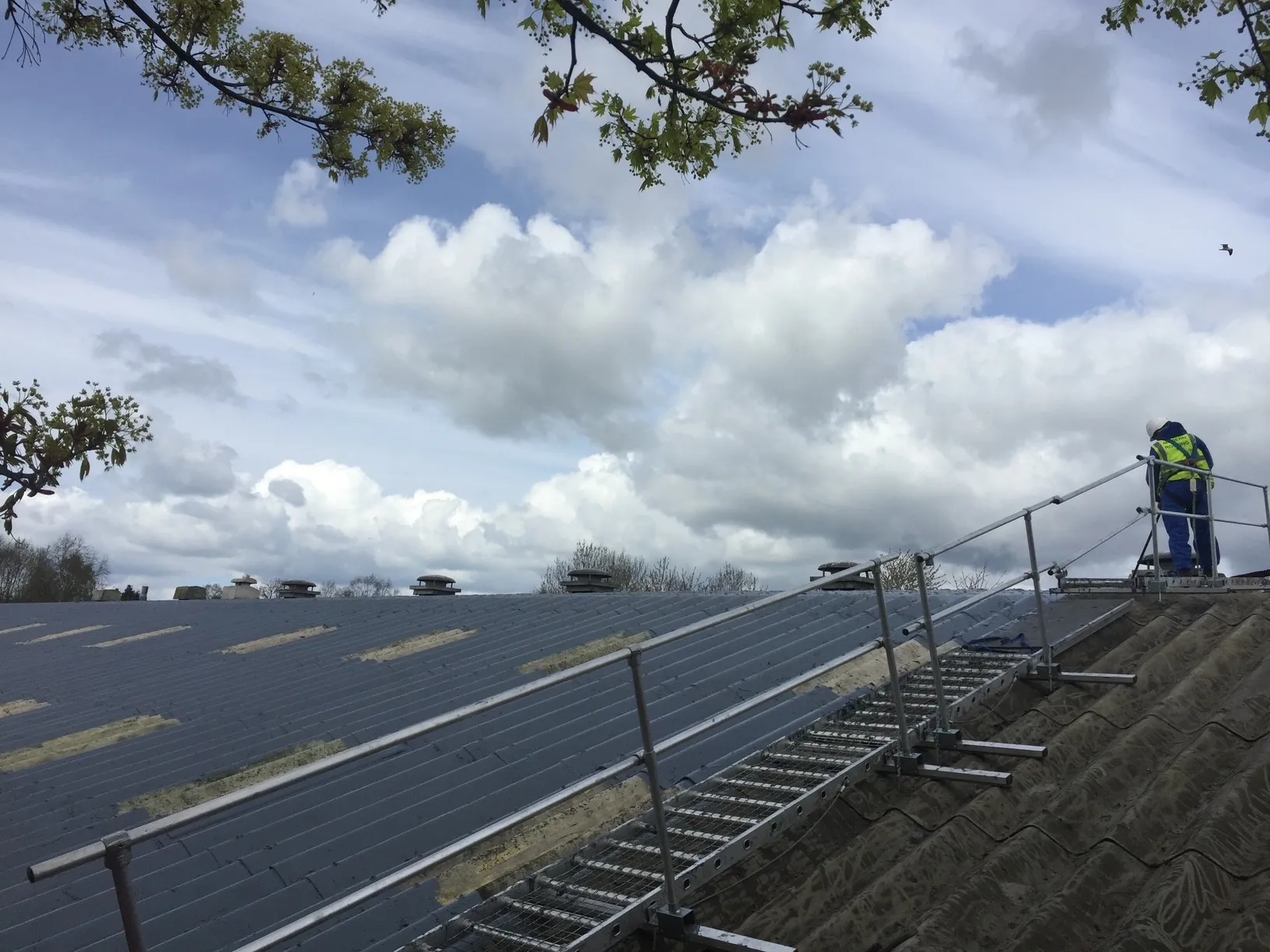 Asbestos cement roof preparation during East Lothian coating works