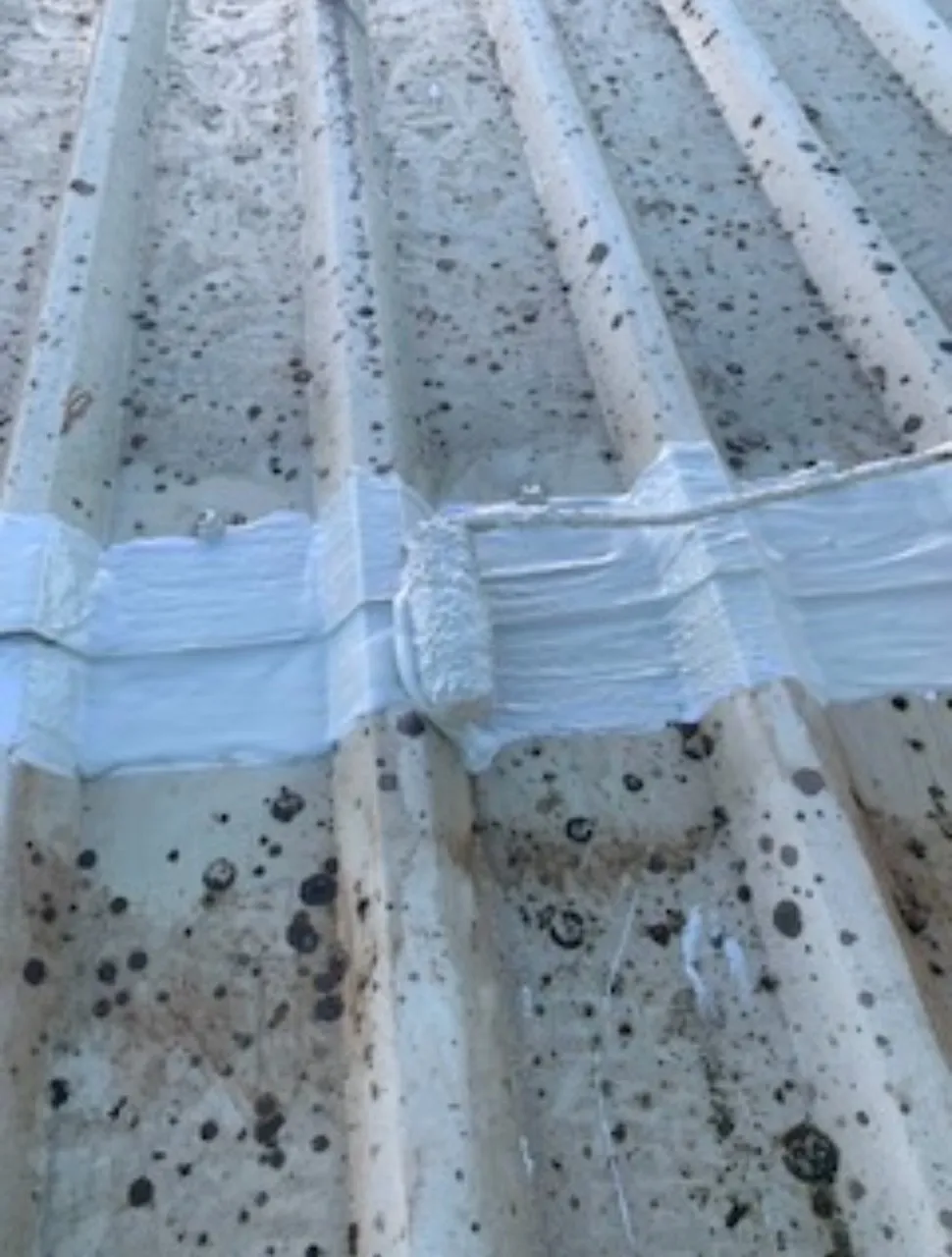 Liquid plastic cut edge corrosion treatment being installed.