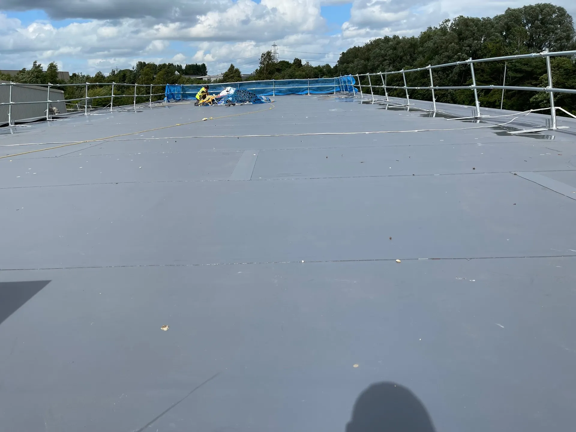 Progress across the larger flat roof areas.