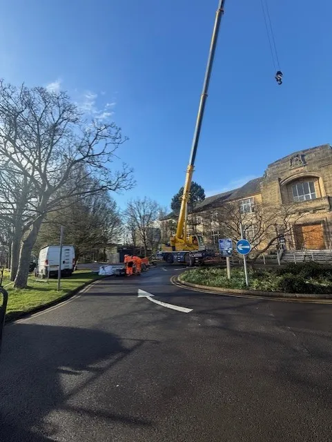 Crane loading materials for 3000m2 Sika membrane roofing project in Edinburgh by Modern Roofing Scotland