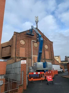 Boom lift used for industrial roof inspection access