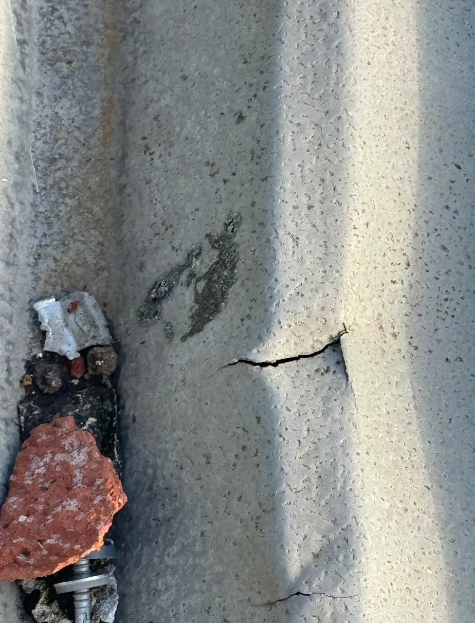 Crack in industrial metal roof sheet