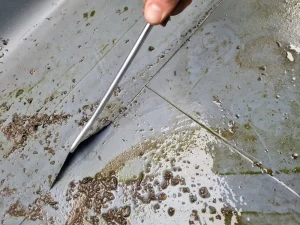 Failed weld in roof membrane found during inspection