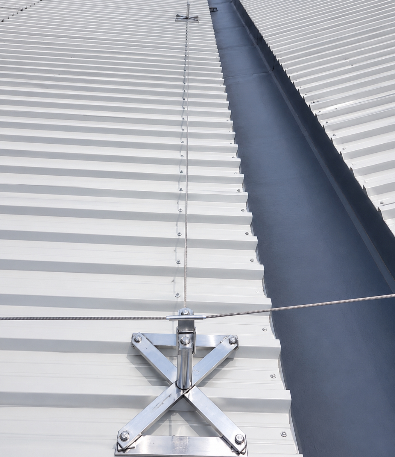 Completed safety line installation on a metal industrial roof