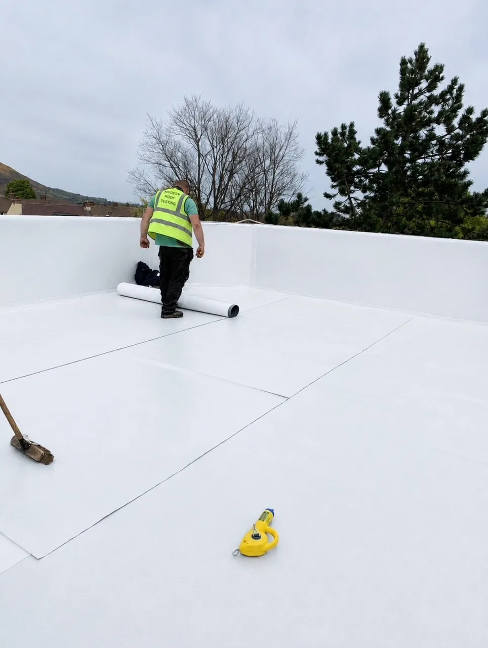 Light coloured commercial membrane roof installation by Modern Roofing