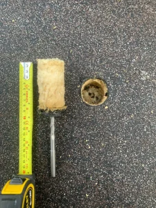 Wet roof core sample from industrial roof survey