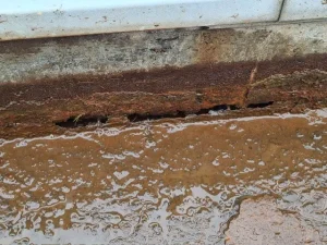 Corroded industrial gutter identified during roof survey
