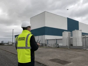 Modern Roofing Technical Roof Surveyor carrying out a drone-supported roof inspection
