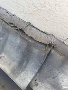 Failed silicone raggle detail causing roof leak risk